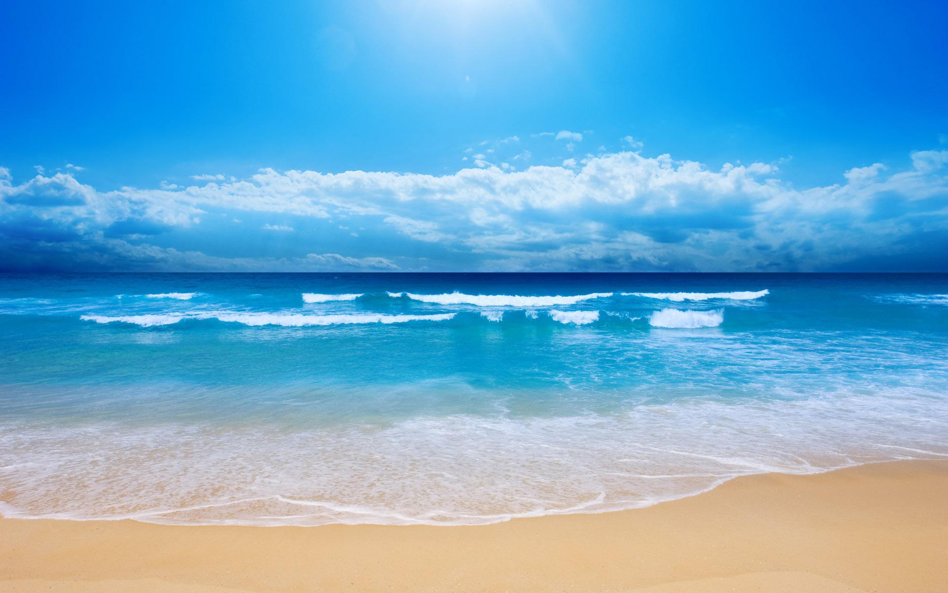Hình nền biển cả xanh lơ với cát vàng